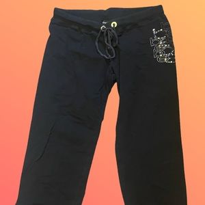 Black Bebe sweat pants with embellished logos